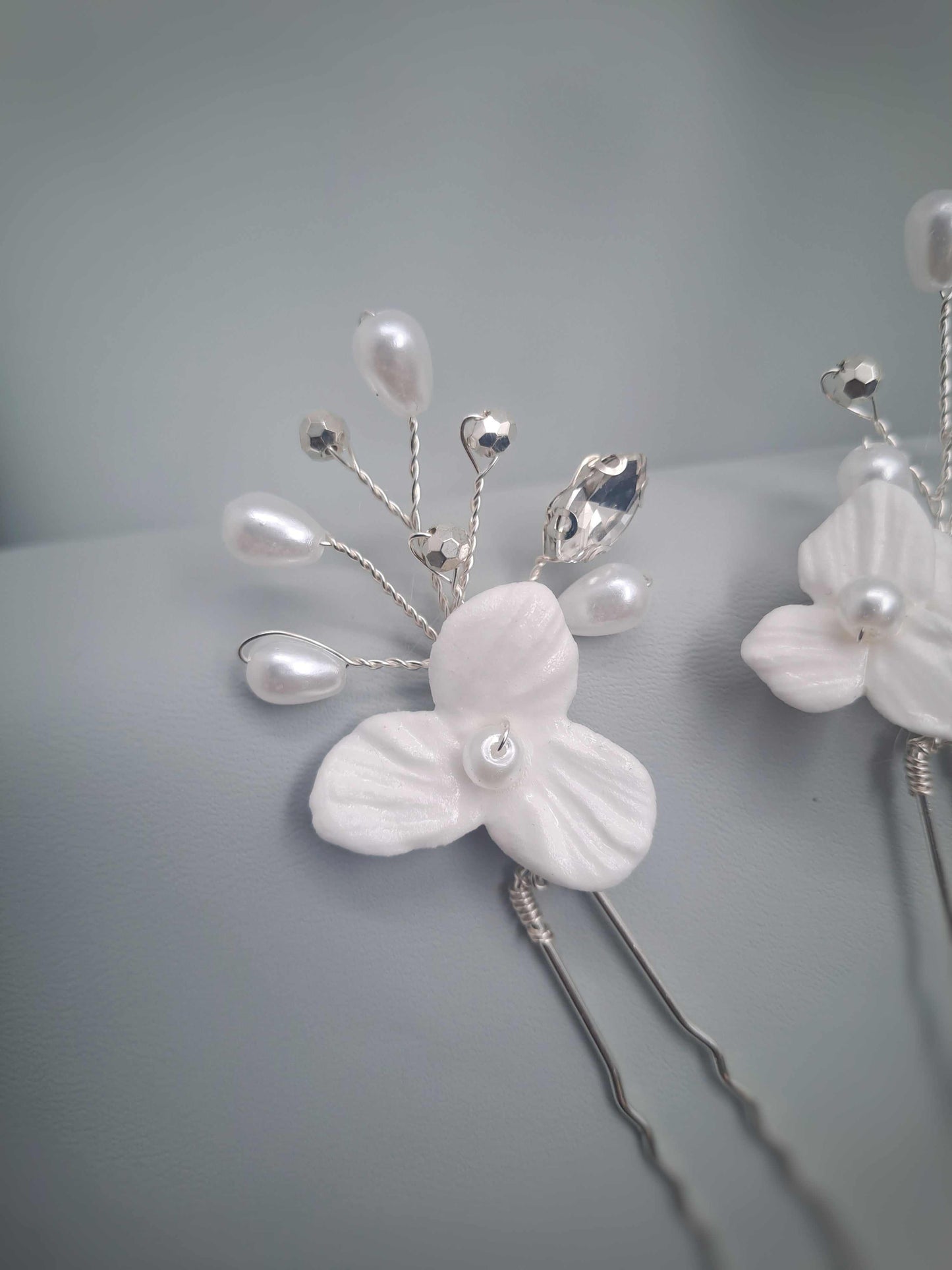 Isla bridal hairpin with delicate white floral design and pearl accents handcrafted in South Africa