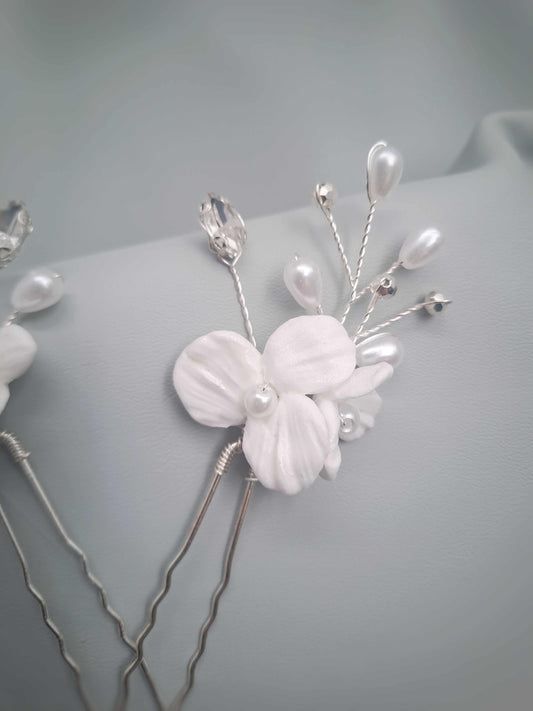 Isla bridal hairpin with delicate white floral and pearl details handcrafted in South Africa