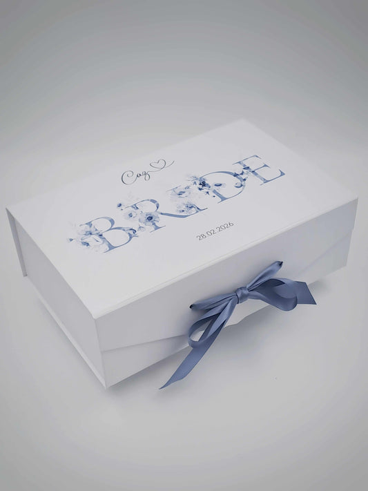 White box with blue text and a bow on a light gray background