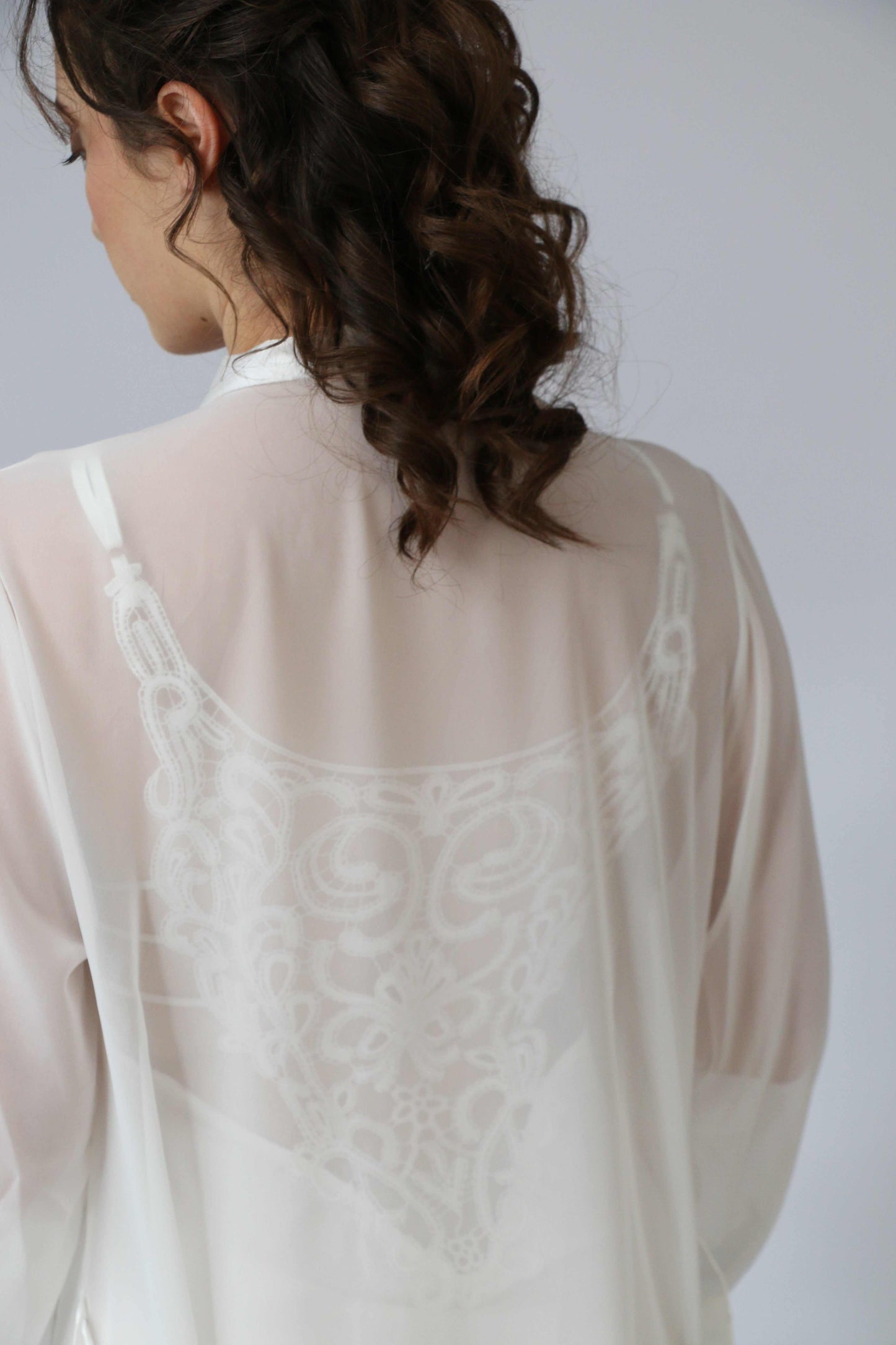 Two-piece bridal robe with feathers and chiffon gown showcasing luxury and elegance