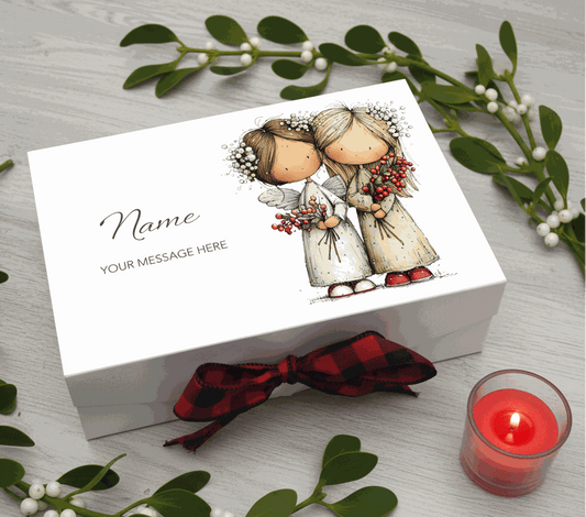 Personalised christmas box with two illustrated angels and a red plaid bow on a white background