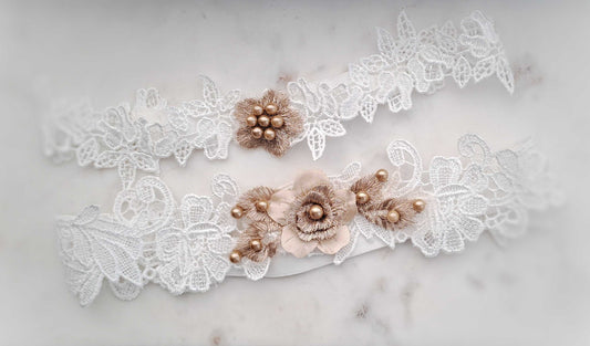 Gold and white demi bridal garter set with 3D flower lace and pearl details on white lace bands.