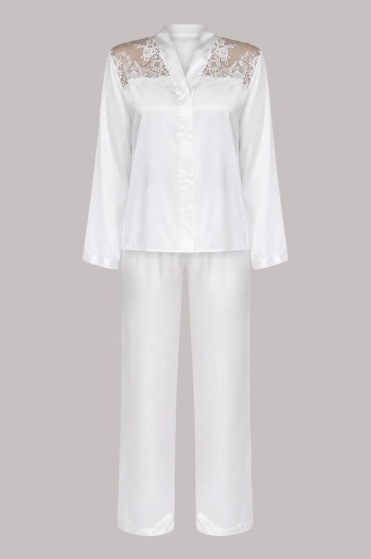 White satin pajama set with a long-sleeve button-front top featuring beige lace shoulder panels and matching wide-leg pants, shown on a plain white background.