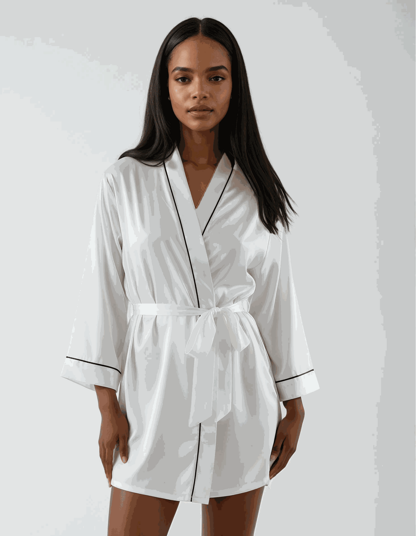 White satin robe with black trim, knee-length, elegant bridal wear