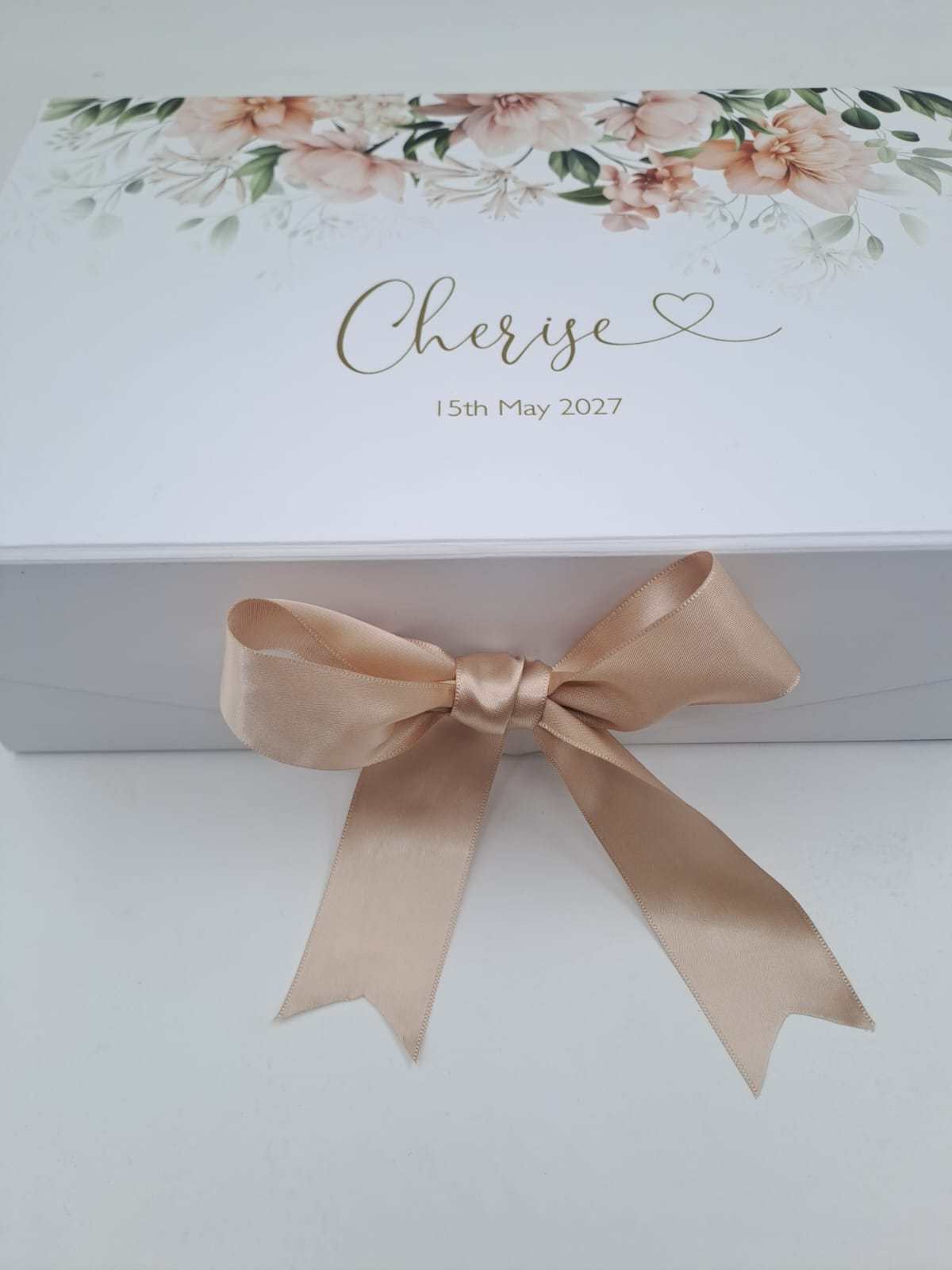 Gift box with floral design and 'Cherise' text on a white background