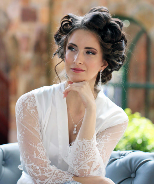 Bridal satin robe with elegant lace sleeves perfect for bridal getting ready moments