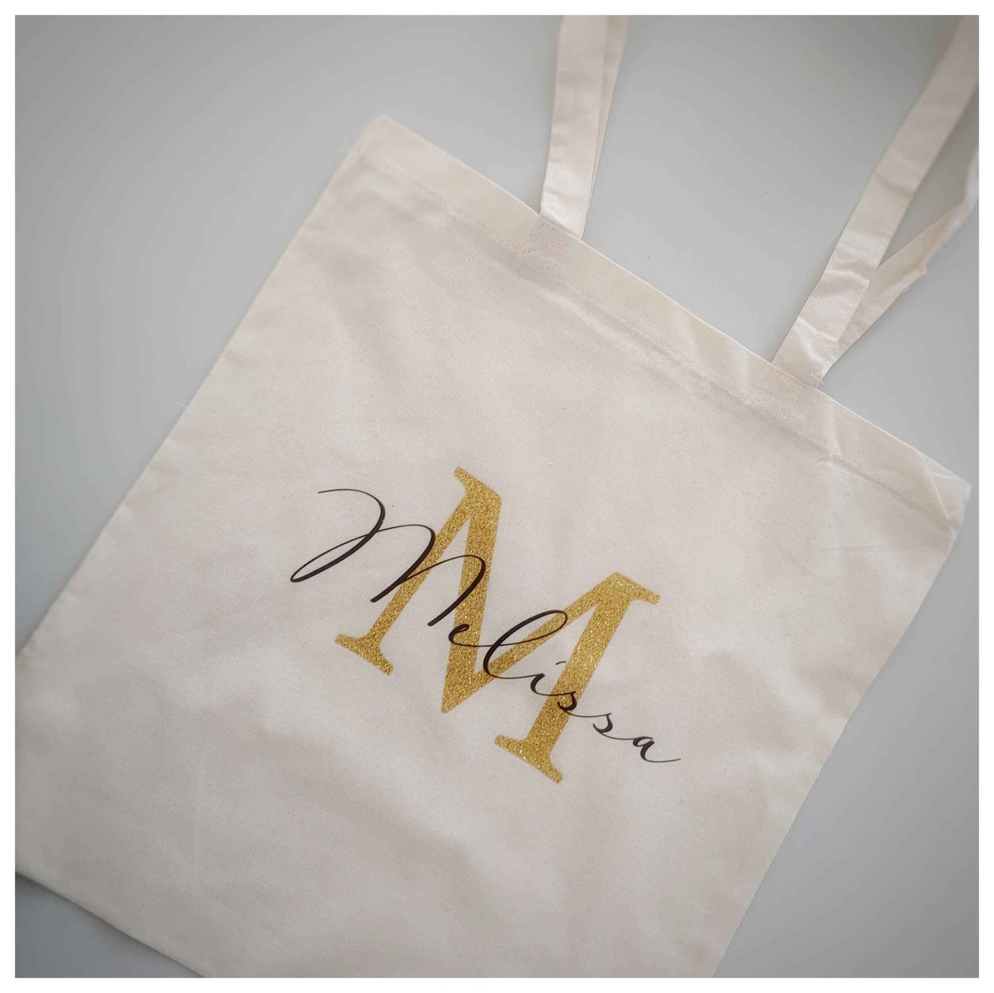 Beige personalised canvas cotton tote bag with gold and black two-colour print, 35cm x 35cm size