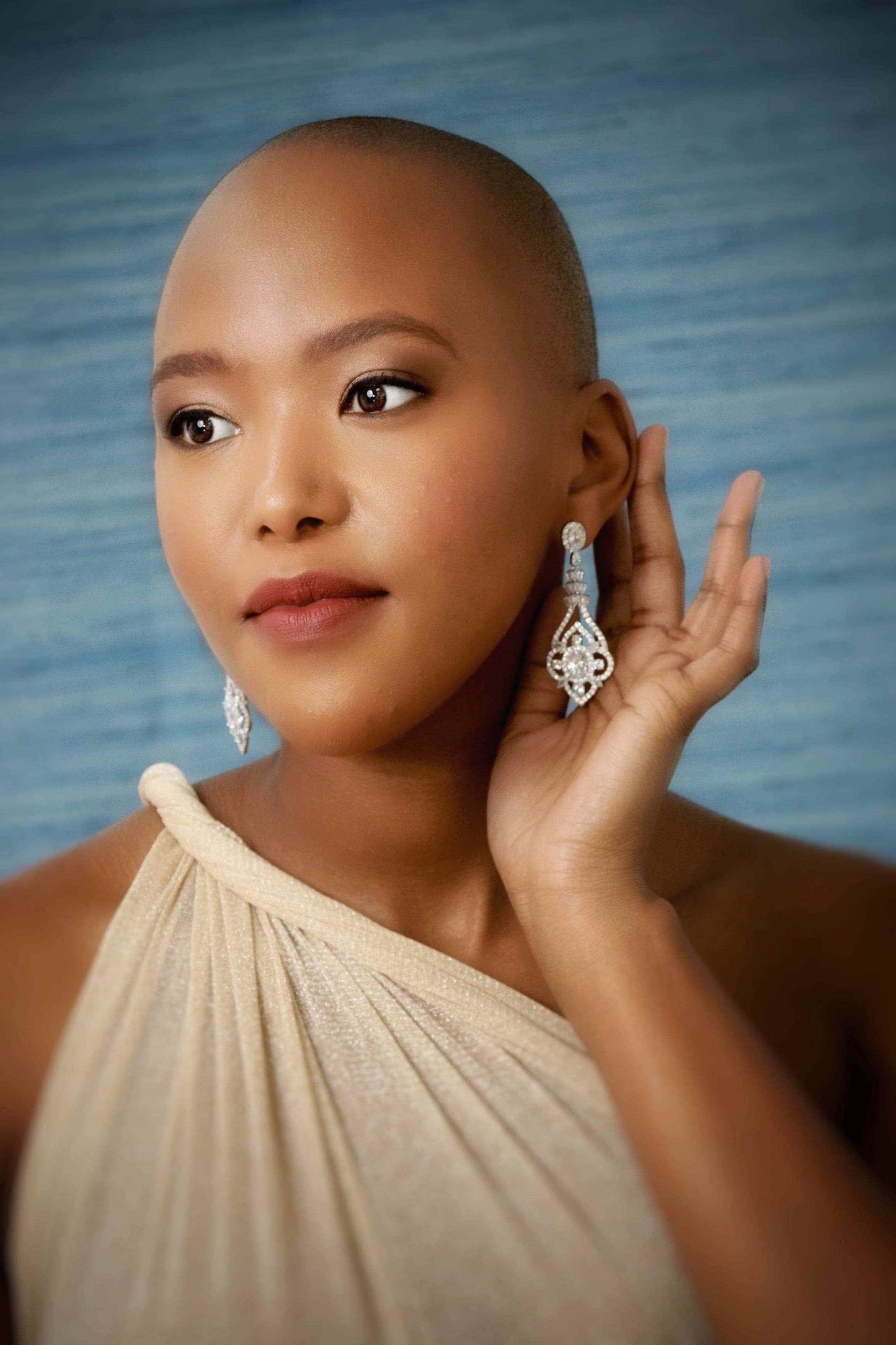 Woman wearing zircon statement bridal drop earrings styled for wedding