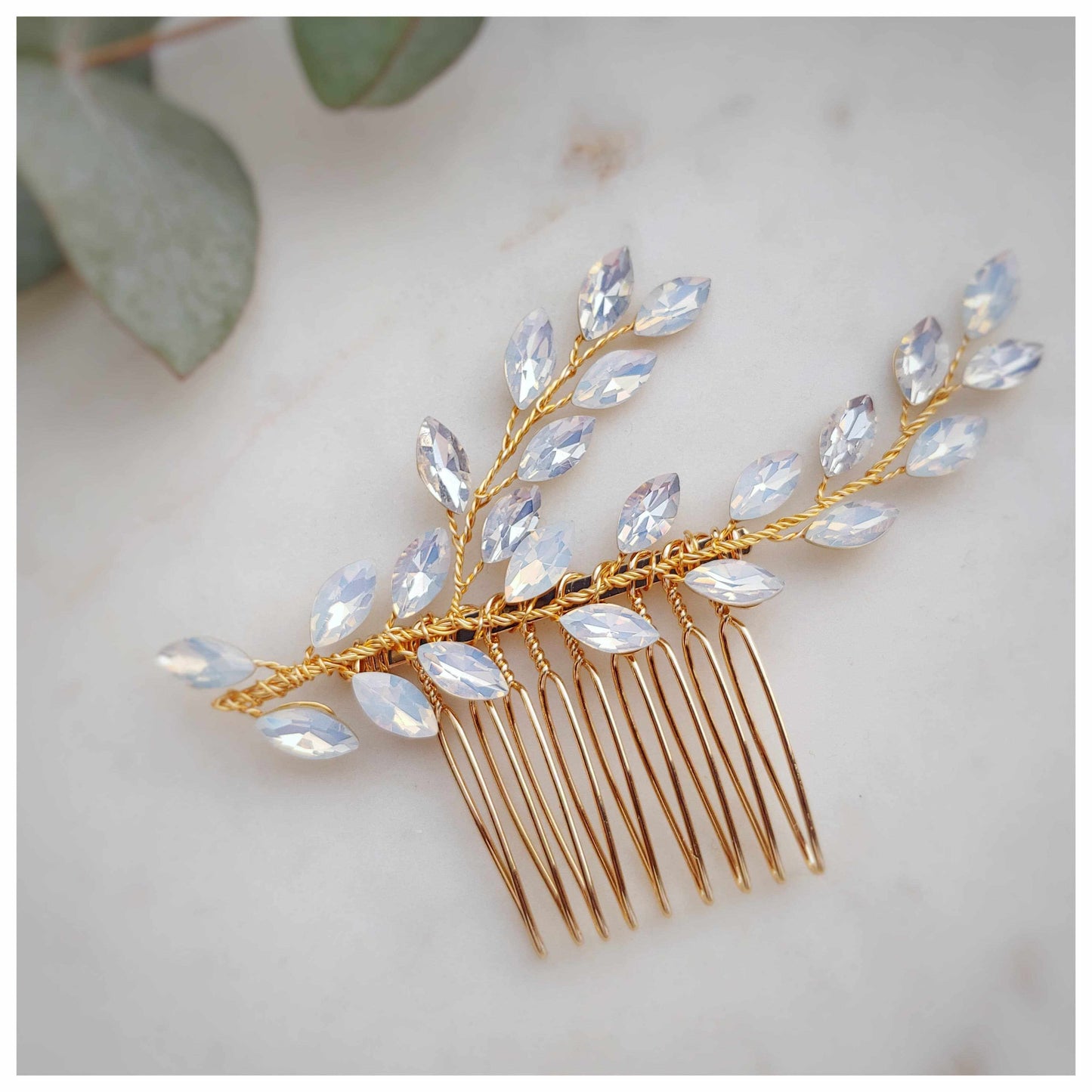 Bridal hair comb with gold base and crystal leaf embellishments