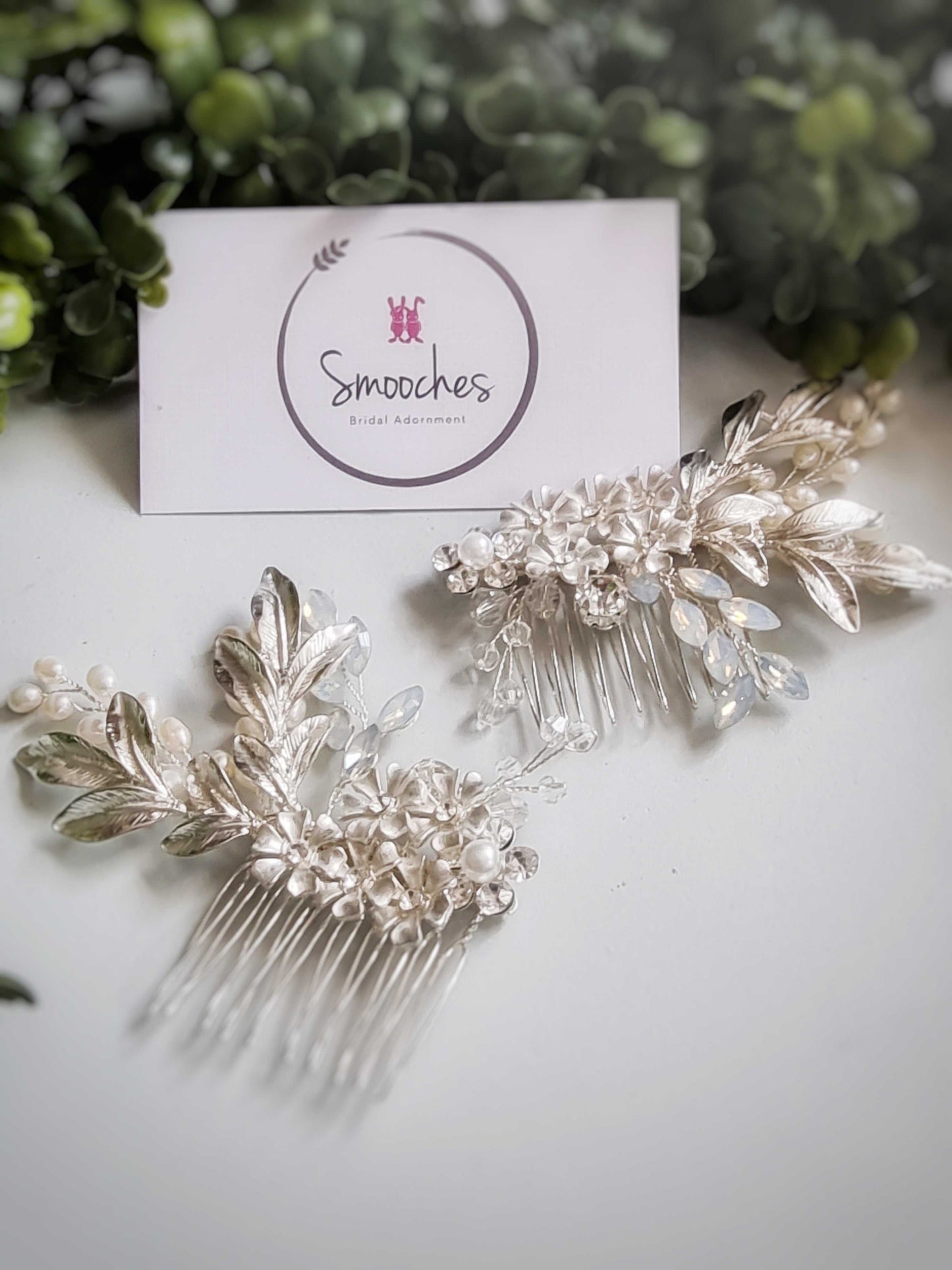 Silver hair comb set with delicate leaf and flower design embellished with Swarovski crystals