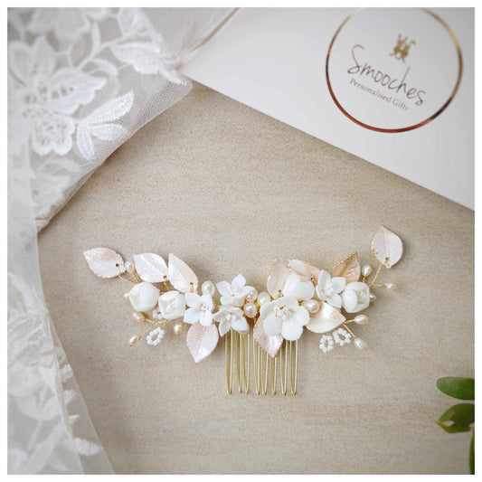 Rose gold bridal hair comb with ceramic flowers and blush pink leaves on gold base