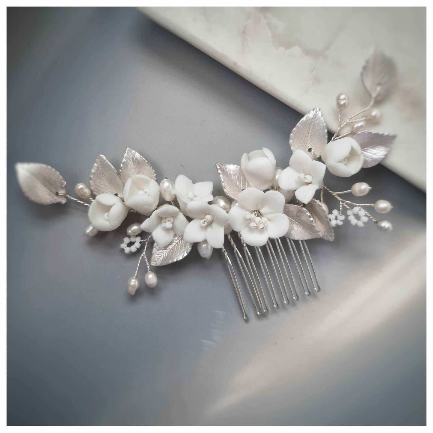 Silver bridal hair comb with ceramic flowers and pearl accents