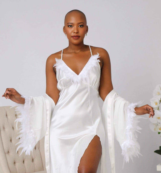 Luxury two-piece bridal gown and soft chiffon robe with duck feather details worn by model