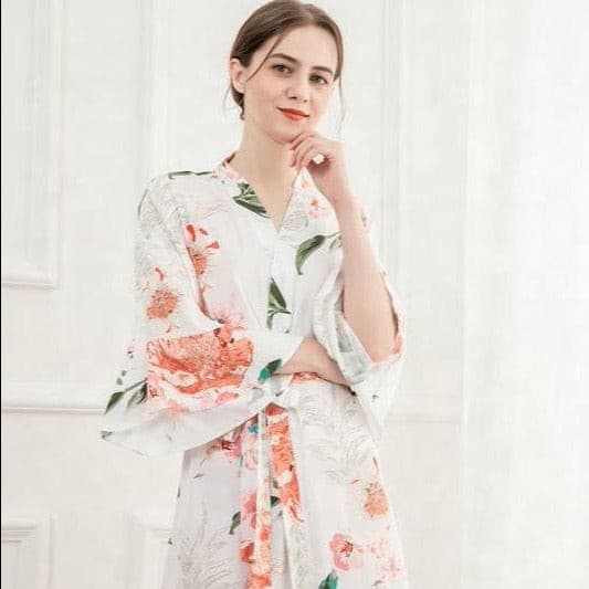 White and blush floral cotton gown with long sleeves and elegant design for versatile wear