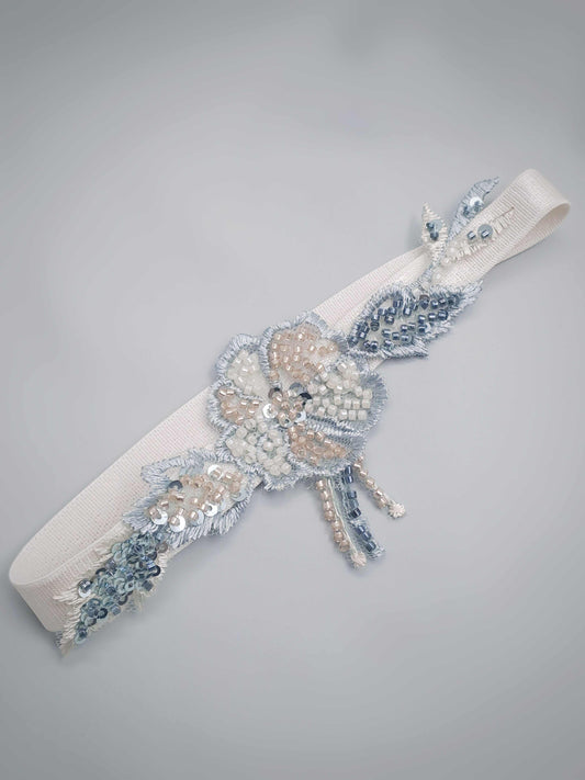 Montrose heirloom wedding garter with champagne, blue, and sage hand beaded floral design on elastic band