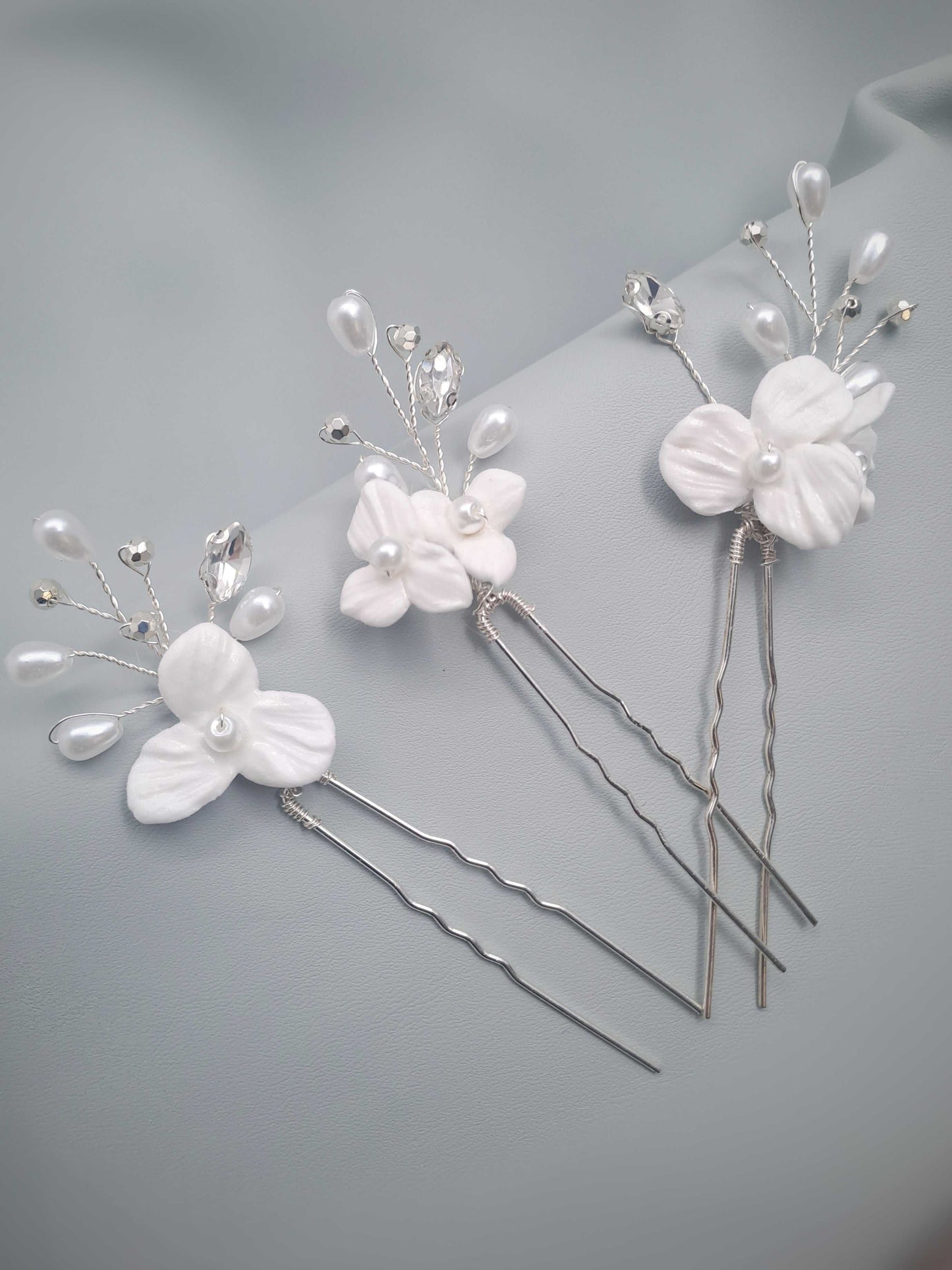 Elegant Isla bridal hairpins with delicate white floral and pearl details handcrafted in South Africa