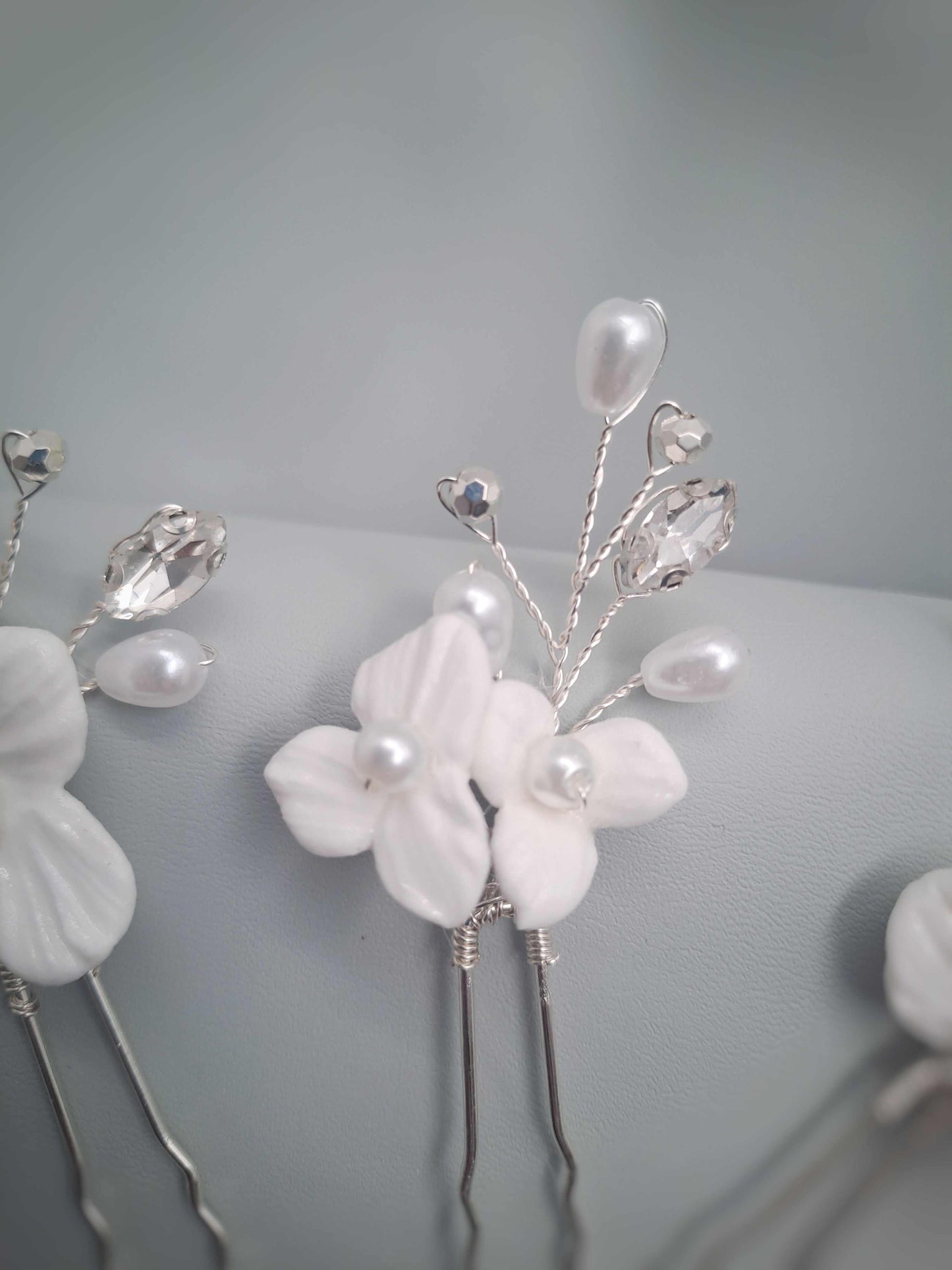 Isla bridal hairpin with white floral details and pearl accents handcrafted in South Africa