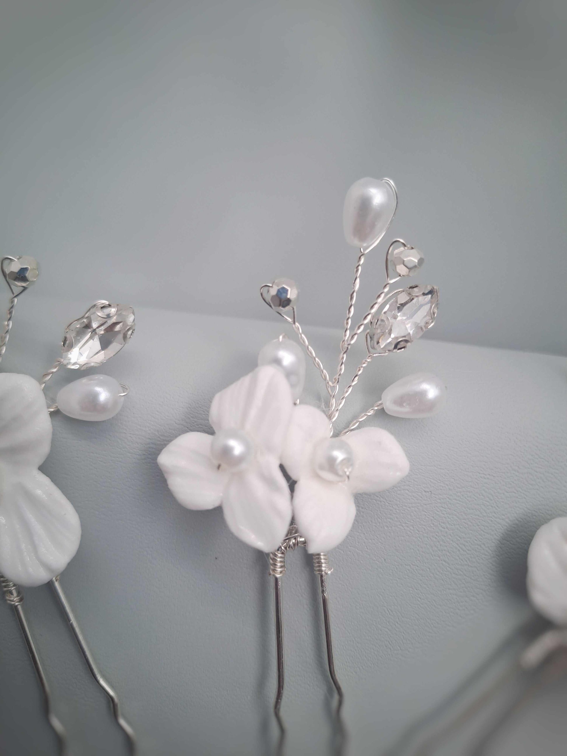 Isla bridal hairpin with white floral details and pearl accents handcrafted in South Africa