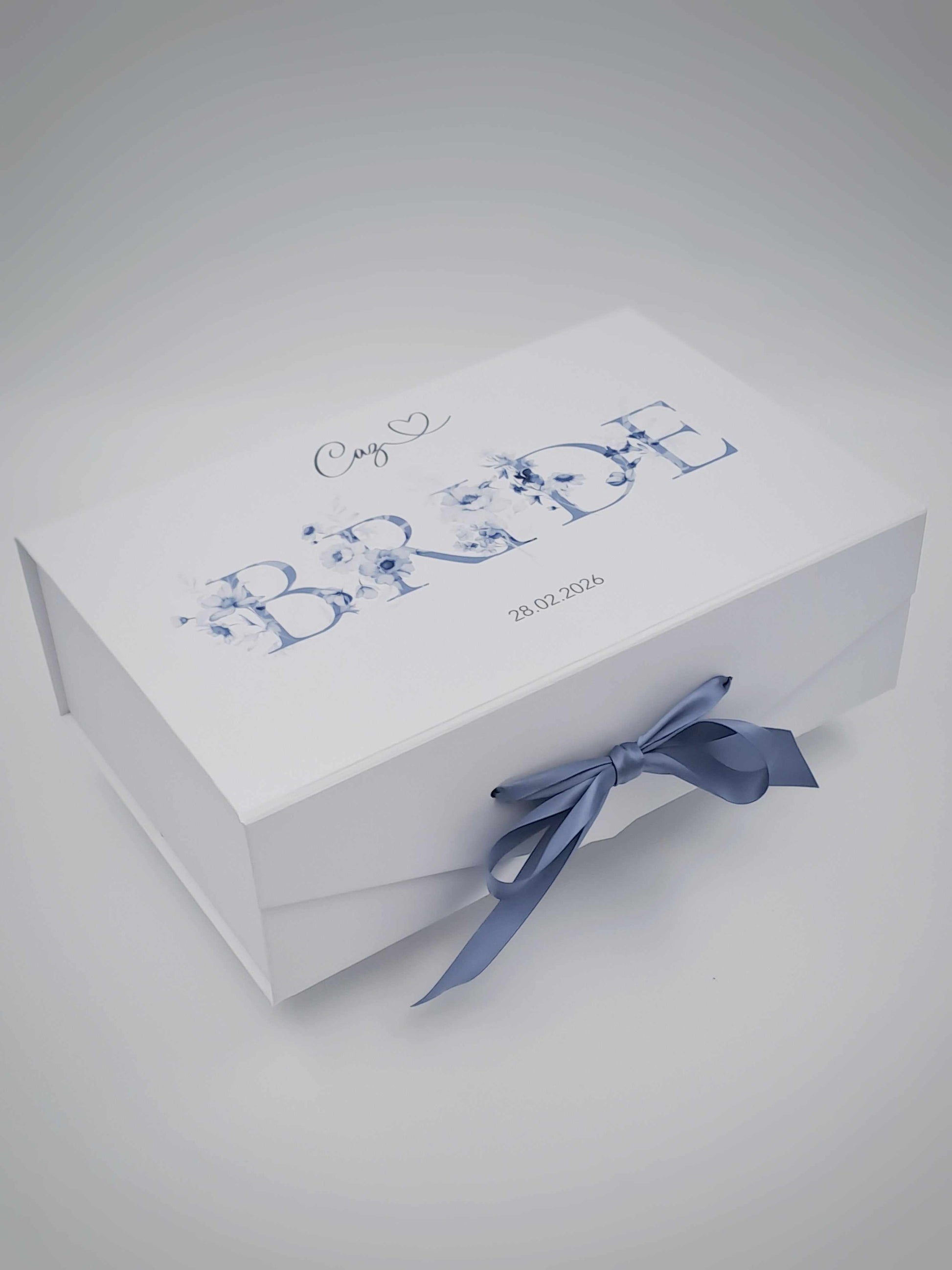White box with blue text and a bow on a light gray background