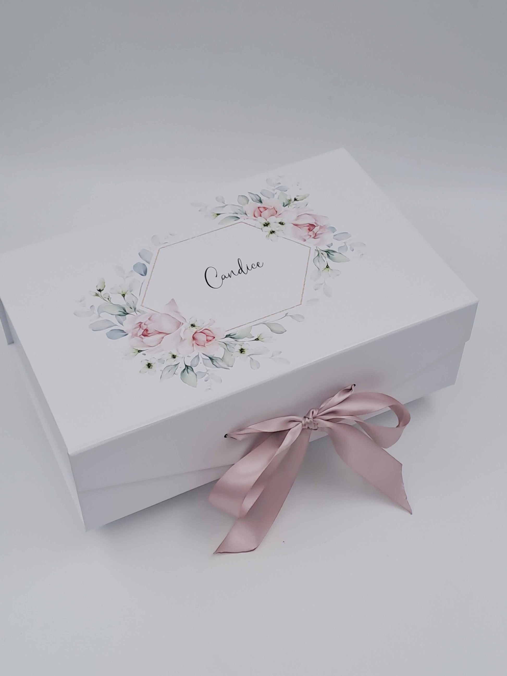 Personalised deluxe gift box with blush floral print, recipient name, and pink satin ribbon bow