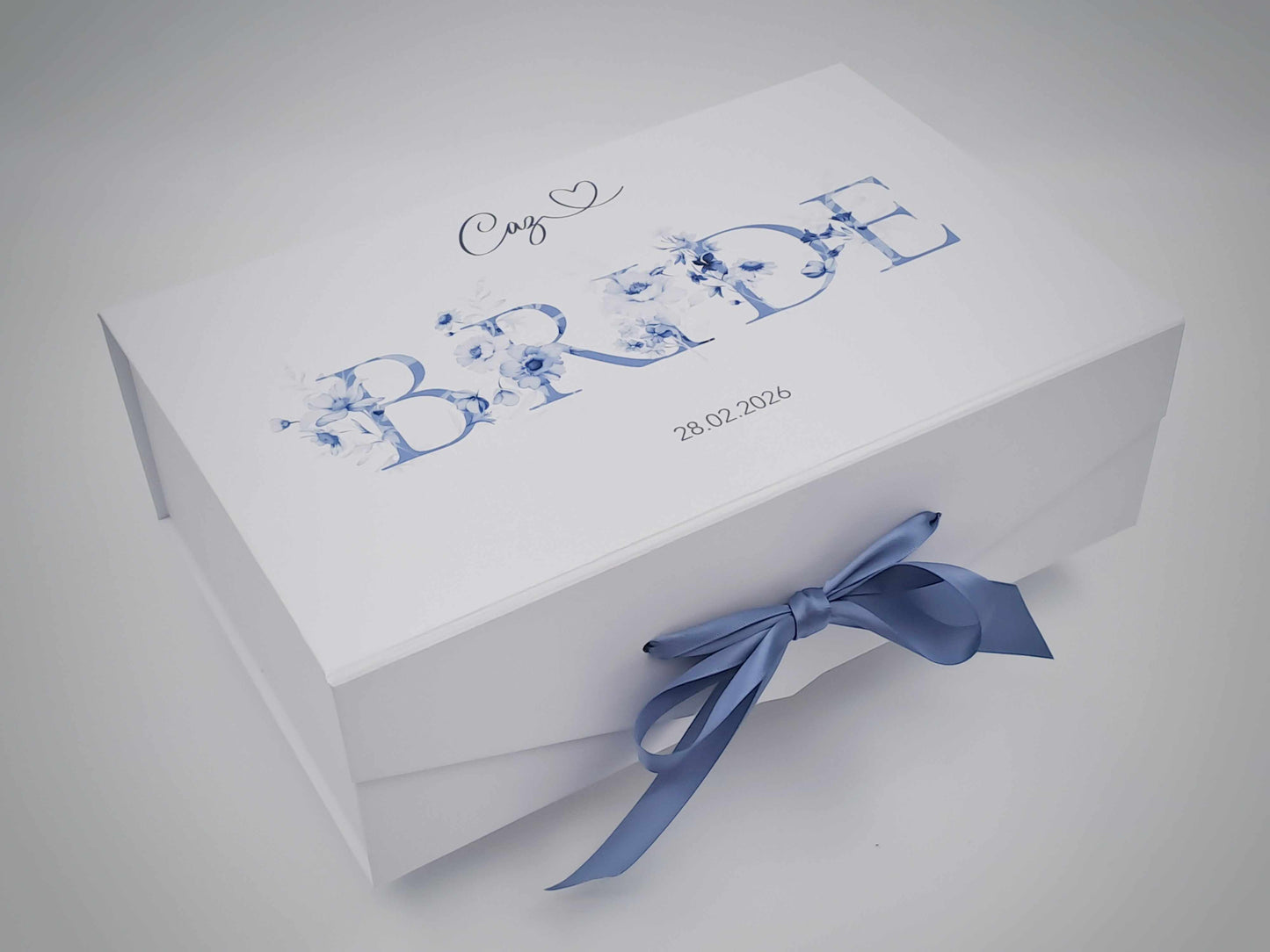 White box with 'Crazy Bride' text and blue bow on a light gray background