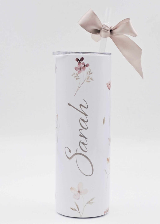 Personalised skinny tumblerwith floral design and ribbon on a white background
