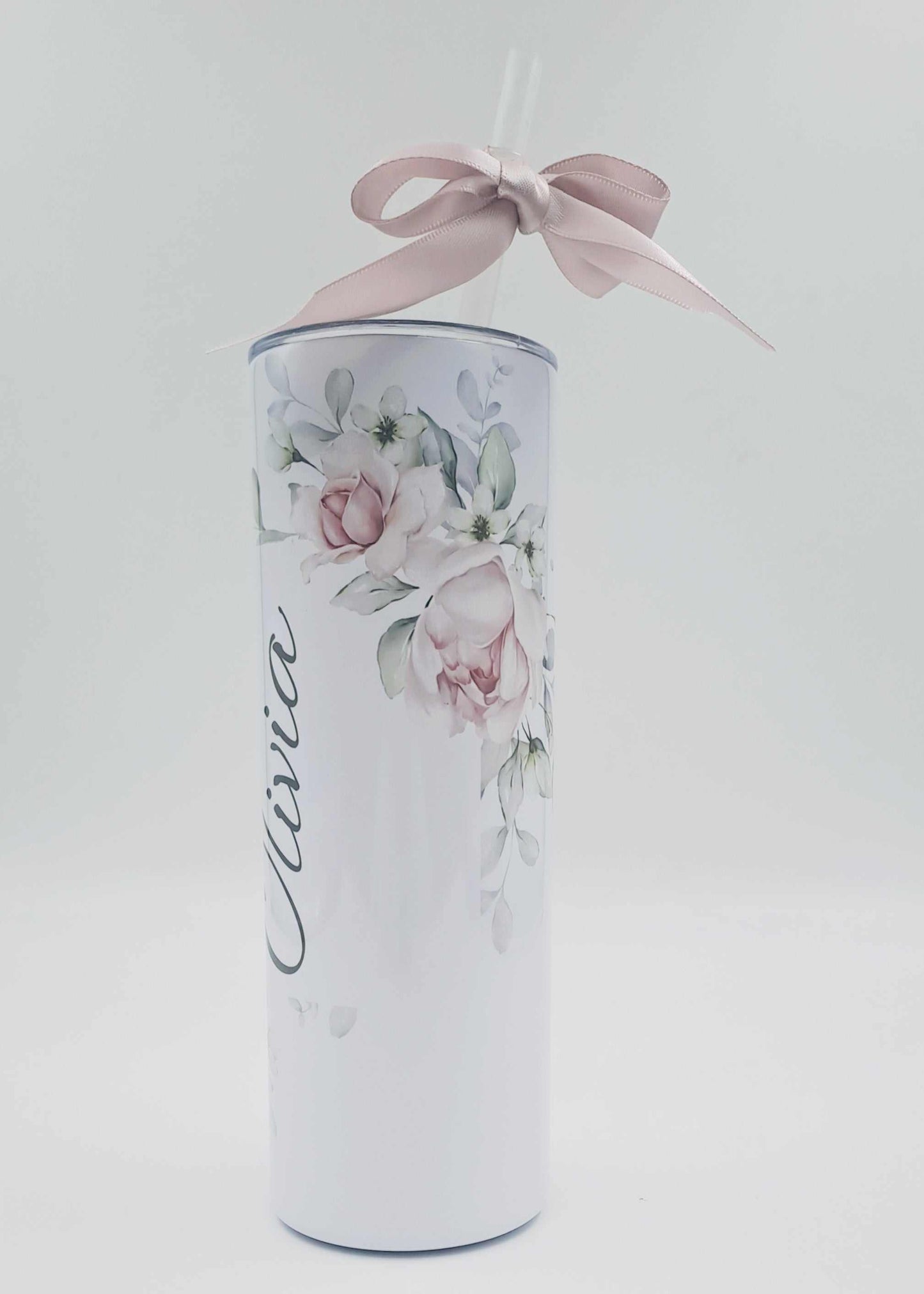 Personalised stainless steel skinny tumbler with floral design, custom name, straw, and pink ribbon gift wrap