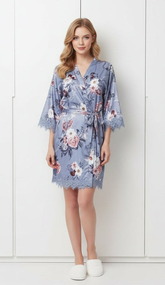 Woman wearing a floral robe against a white background