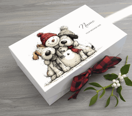 Card with cartoon dogs and a snowman, featuring a red and black checkered ribbon on a white background.