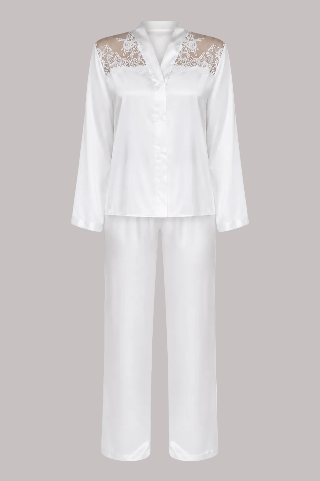 White satin pajama set with a long-sleeve button-front top featuring beige lace shoulder panels and matching wide-leg pants, shown on a plain white background.