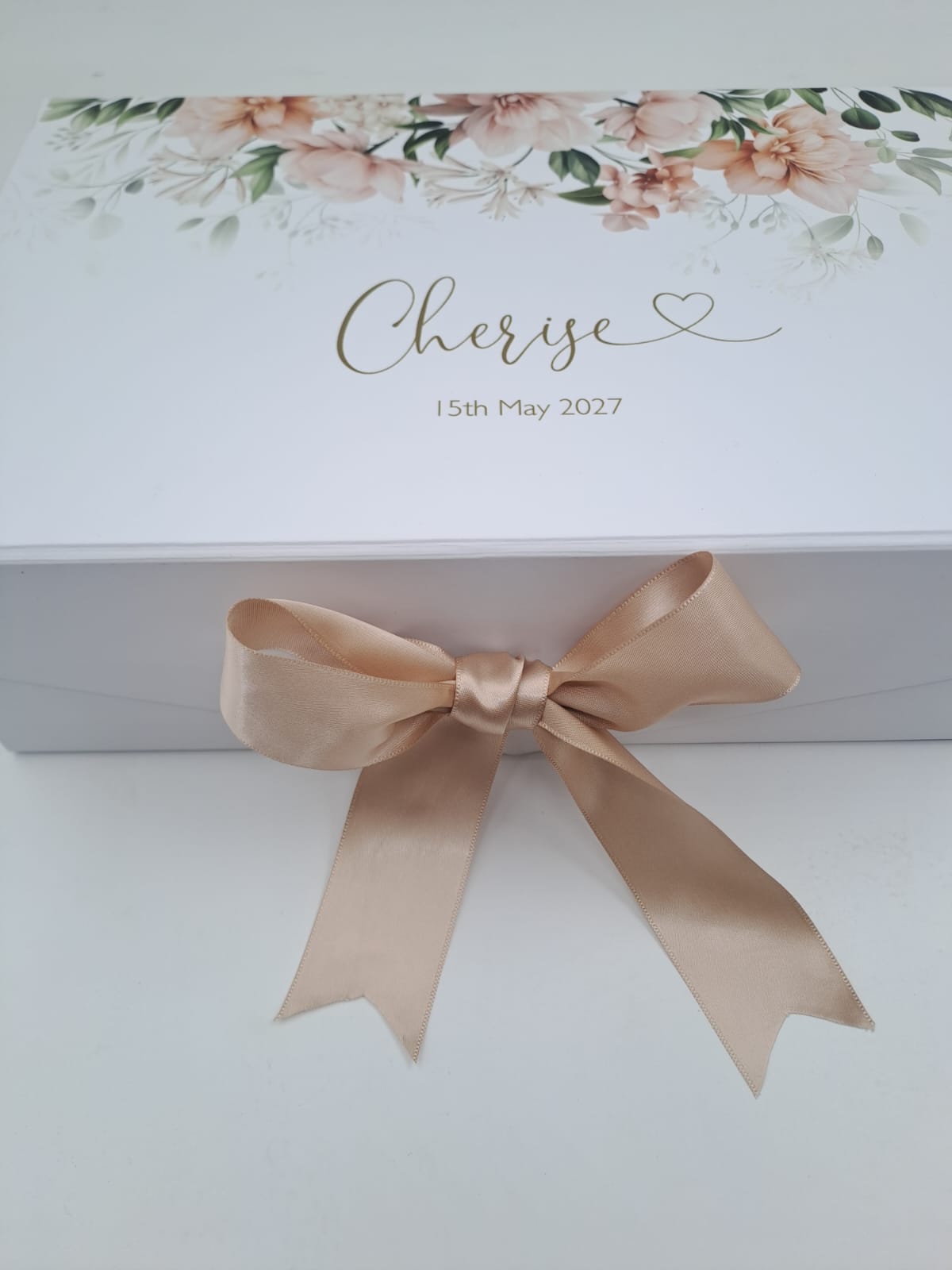 Gift box with floral design and 'Cherise' text on a white background