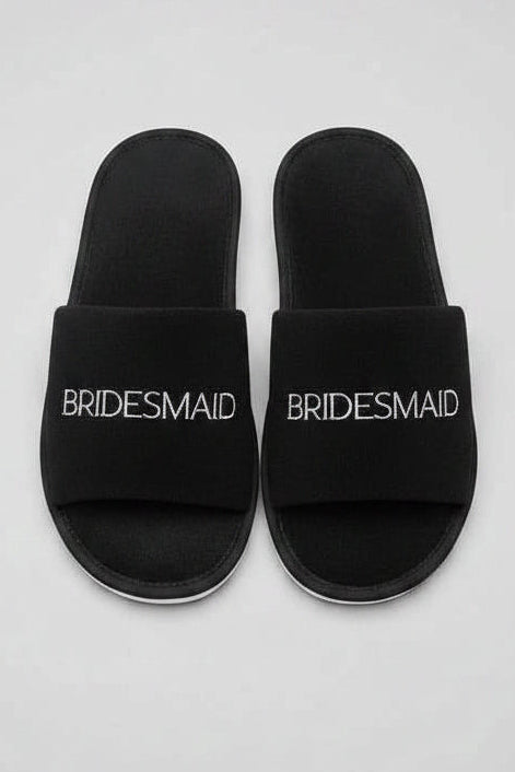 Disposable bridal party black slippers for wedding preparations and comfort
