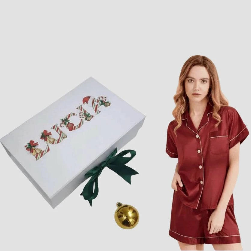 Red satin pajama set with a Christmas gift box 