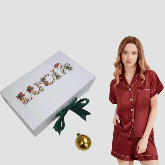 Red satin pajama set with a Christmas gift box 
