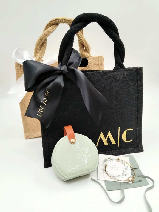 Bridesmaid mini tote gift set with black and natural jute mini totes, satin bow, gold lettering, mint jewellery case and bracelet card.